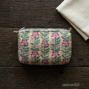 A three-piece nesting set of Beige Floral Quilted Cotton Toiletry Bags neatly arranged on a clean vanity counter showing the large, medium, and small size profiles.
