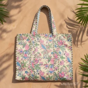 A person carrying a large Beige Quilted Cotton Tote Bag comfortably over their shoulder during a weekend beach holiday trip.