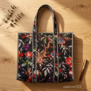 A person carrying a large square Bird Print Quilted Cotton Tote Bag comfortably over their shoulder during a grocery shopping run.