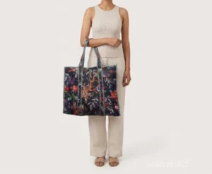 Close-up of the bird block print detailing, dense parallel line quilted stitching rows, square layout profile, and comfortable shoulder straps on an Indian cotton tote bag.