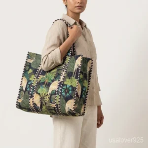 Close-up of the handcrafted royal bird block print detailing, dense quilted stitching texture lines, robust handle attachments, inner pocket slot, and neat edges on an Indian cotton carryall tote.