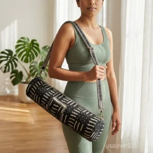 Close-up of the premium full-length zipper track, detachable strap hardware, and detailed quilted stitching on a monochrome woven yoga bag.
