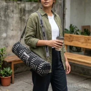 Mudcloth Style Yoga Mat Bag with an adjustable shoulder strap showing the bold black and white tribal ethnic print.