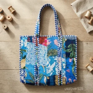 A person carrying a large Blue Floral Block Print Quilted Indian Cotton Tote Bag comfortably over their shoulder during a casual weekend trip.