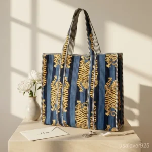 Close-up of traditional tiger print motif and high-quality premium quilted stitching on an oversized cotton tote bag.