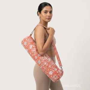 Coral Floral Quilted Yoga Mat Bag with an adjustable crossbody strap showing the salmon pink and white block print.