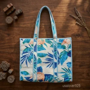 A person carrying a large Designer Multicolor Block Print Quilted Cotton Tote Bag comfortably over their shoulder during an outdoor weekend vacation travel trip.