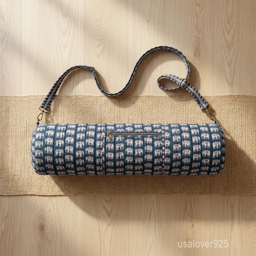 A fitness enthusiast carrying the Indigo Elephant Print Quilted Yoga Mat Bag over the shoulder by the adjustable strap, showcasing its slim profile and vibrant bohemian accessory style while heading to a studio class.