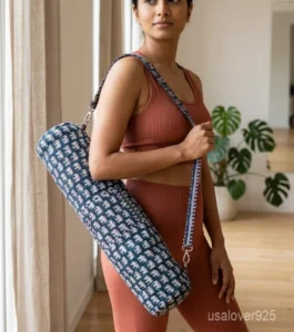 Indigo Elephant Print Quilted Yoga Mat Bag showing the traditional hand block print artisan design with the full-length zipper closure, outer zip pocket, and adjustable shoulder strap.