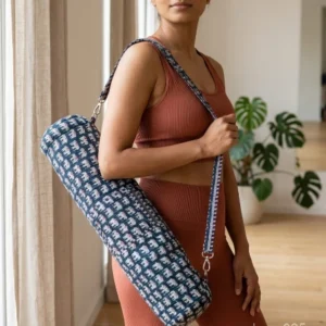 Indigo Elephant Print Quilted Yoga Mat Bag showing the traditional hand block print artisan design with the full-length zipper closure, outer zip pocket, and adjustable shoulder strap.