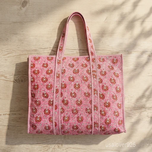 A bridesmaid holding a large Embroidered Floral Quilted Cotton Tote Bag during a bohemian outdoor wedding party celebration.