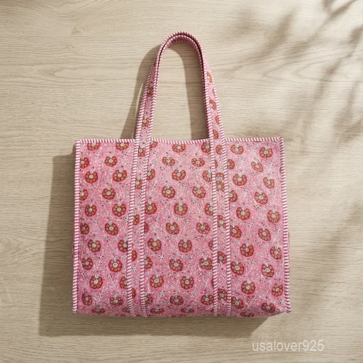 Embroidered Floral Quilted Cotton Tote Bag with comfortable shoulder handles showing the vibrant block print and detailed decorative stitching.