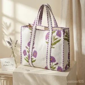 Close-up of vibrant jewel-toned floral print patterns and high-quality quilted stitching on an Extra Large Floral Quilted Tote.