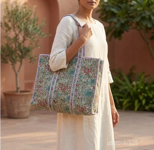 Floral Block Print Quilted Cotton Tote Bag in earthy tones with large shoulder handles showing the traditional botanical design.