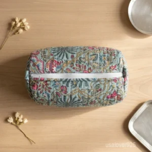 A three-piece nesting set of Floral Block Print Toiletry Bag Set neatly arranged on a clean vanity counter showing the large, medium, and small size configurations.
