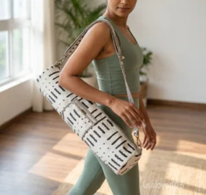 Close-up of the convenient integrated front pocket, top closure system, and premium quilted stitching on a floral cotton yoga bag.