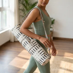 Close-up of the convenient integrated front pocket, top closure system, and premium quilted stitching on a floral cotton yoga bag.