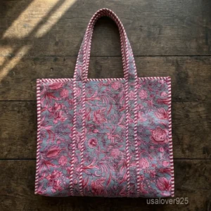 A person carrying a large Floral Quilted Cotton Tote Bag comfortably over their shoulder during an outdoor weekend vacation travel trip.