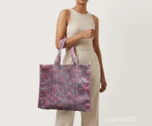 Close-up of the botanical block print detailing, dense parallel line quilted stitching rows, extra-wide 7-inch deep bottom gusset base, and reversible double-sided pattern layout on an Indian cotton tote bag.