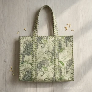 A person carrying a large Floral Quilted Cotton Tote Bag comfortably over their shoulder during a casual weekend travel trip.