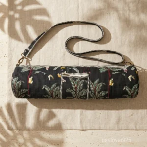 Woman walking to a workout studio carrying a Floral Quilted Cotton Yoga Mat Bag comfortably as a crossbody sling.