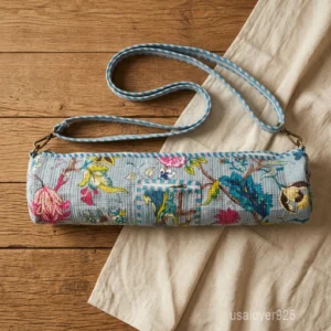 Close-up of the convenient integrated front pocket, top closure system, and premium quilted stitching on a floral cotton yoga bag.