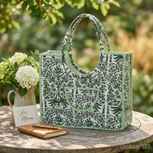 Green Floral Quilted Cotton Tote Bag with comfortable over-the-shoulder handles held against a natural background.