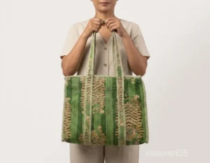 Close-up of the clean vertical stripes, dense 3-layer quilted stitching rows, and comfortable 13-inch shoulder carry handles on an Indian cotton tote bag.