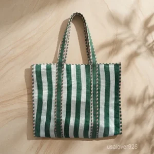 Green White Quilted Cotton Tote Bag with large shoulder handles showing the fresh botanical design and decorative cotton tassels trim.