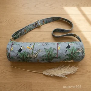 Grey Tropical Yoga Mat Bag showing the traditional hand block print artisan design with the full-length zipper closure, outer zip pocket, and adjustable shoulder strap.