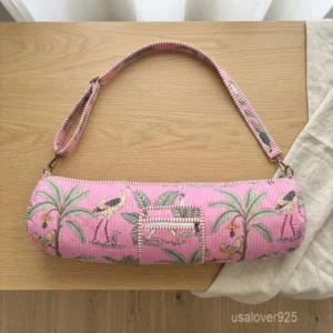 Hand Block Print Pink Yoga Mat Bag carrier showing the traditional artisan crane print design with the full-length zipper closure and outer pocket.