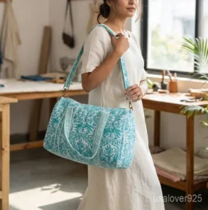 A traveler carrying the Green Floral Quilted Cotton Weekender Bag by the wide straps, showcasing its generous packing capacity and vibrant bohemian travel style.