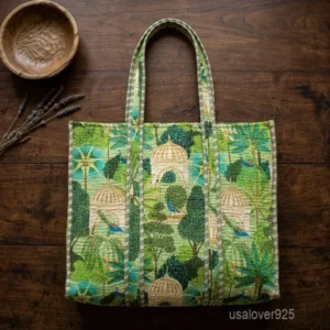 A shopper carrying the Mughal Garden Peacock Print Quilted Tote Bag by the wide straps, showcasing its generous packing capacity and vibrant bohemian accessory style while walking outdoors.