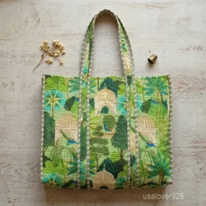 Mughal Garden Peacock Print Quilted Tote Bag showing the traditional hand block print artisan design with the spacious main compartment opening and reinforced shoulder straps.