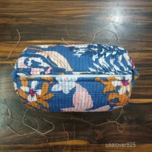 A nesting kit of Floral Cotton Toiletry Bags Set neatly arranged on a clean marble bathroom vanity counter showing the large, medium, and small size profiles.