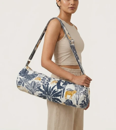 Indigo Gold Tiger Quilted Yoga Mat Bag showing the traditional hand block print artisan design with the full-length zipper closure, outer zip pocket, and adjustable shoulder strap.