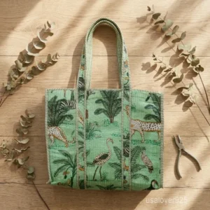 A person carrying a large Jungle Safari Quilted Cotton Tote Bag comfortably over their shoulder during an outdoor weekend travel trip.
