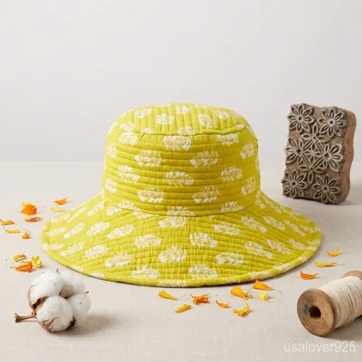 Person wearing a Light Green Quilted Cotton Bucket Hat for a Soft Minimalist aesthetic.