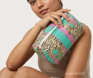 A three-piece nesting set of Multicolor Quilted Toiletry Bag Set neatly arranged on a clean vanity counter showing the large, medium, and small size configurations.