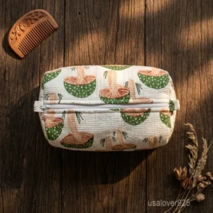 A three-piece nesting set of Mushroom Print Quilted Cosmetic Bags neatly arranged on a clean vanity counter showing the large, medium, and small size profiles.