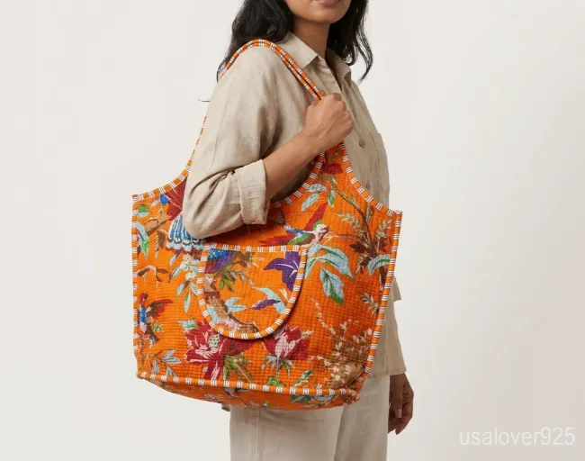 Orange Bird Print Quilted Cotton Tote Bag with comfortable over-the-shoulder straps featuring an ethnic orange bird print.
