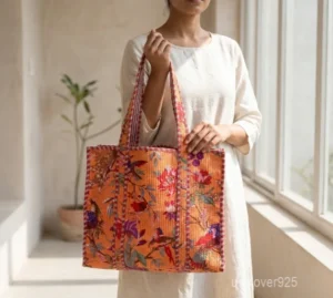 Orange Quilted Cotton Tote Bag with large shoulder handles showing the vibrant traditional handprinted artisan design.