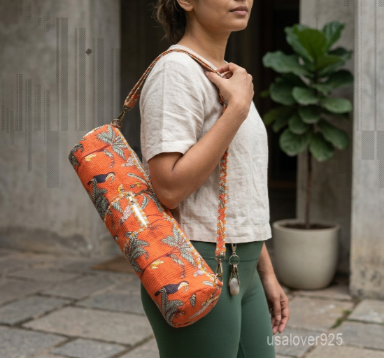 Close-up of the integrated front stash pocket, top closure system, and premium quilted stitching on a toucan print cotton yoga bag.