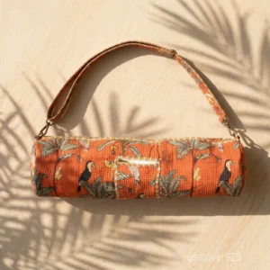 Woman walking to a workout studio carrying an Orange Toucan Jungle Print Quilted Cotton Yoga Mat Bag comfortably as a crossbody sling.