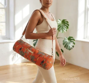 Orange Toucan Jungle Print Quilted Cotton Yoga Mat Bag with an adjustable shoulder strap showing the vibrant tropical bird and foliage design.