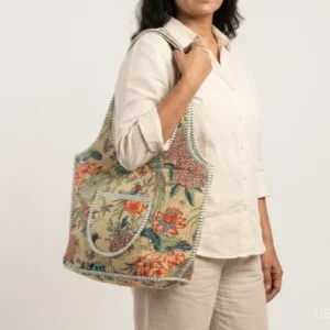 Bird Print Quilted Boho Tote with comfortable over-the-shoulder straps featuring an ethnic peach bird print.