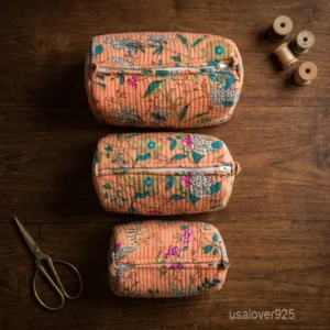 Set of 3 Peach Floral Quilted Cosmetic Bag Set nesting configuration showing the traditional hand-block print artisan design and secure zipper lines with tassel trims.
