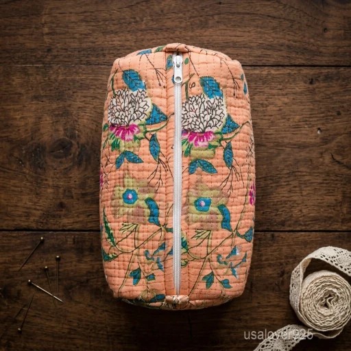 Set of 3 Peach Floral Quilted Cosmetic Bag Set nesting configuration showing the traditional hand-block print artisan design and secure zipper lines with tassel trims.