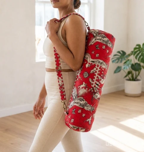 Red Quilted Cotton Yoga Mat Bag carrier showing the traditional artisan jungle print design with the full-length zipper closure and outer pocket.