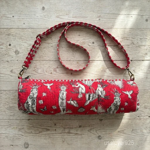 Red Quilted Cotton Yoga Mat Bag carrier showing the traditional artisan jungle print design with the full-length zipper closure and outer pocket.
